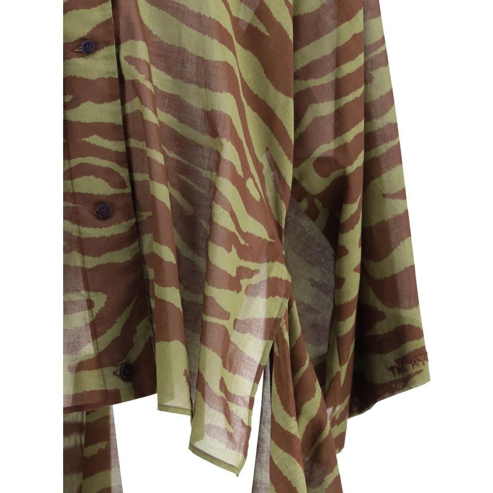 Close-up of The Attico asymmetrical dress with wide sleeves in zebra print, featuring a front button closure and dynamic design.