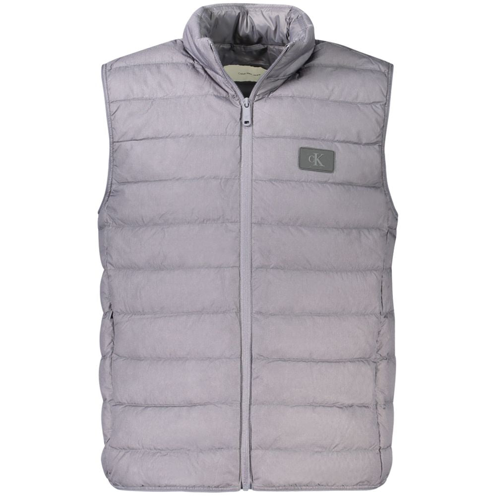 Calvin Klein gray polyamide men's sleeveless jacket with zip closure, featuring two external pockets and iconic logo.