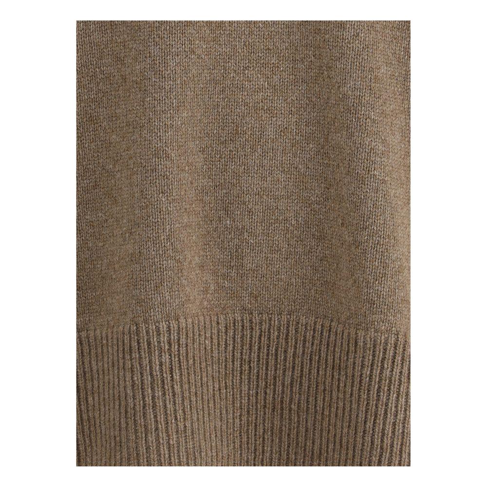 Close-up of The Row Hibem cashmere sweater showcasing its ribbed hem and monochrome design
