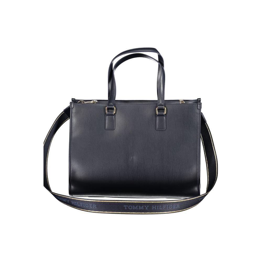 Tommy Hilfiger blue polyethylene handbag with shoulder handles and adjustable strap, featuring internal pocket and zip closure.