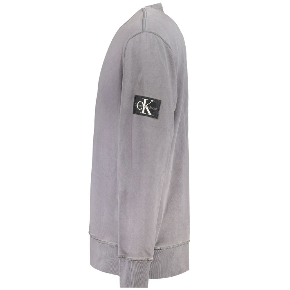 Calvin Klein gray cotton men's sweater with logo patch on sleeve, long sleeves, showcasing stylish and sustainable fashion.