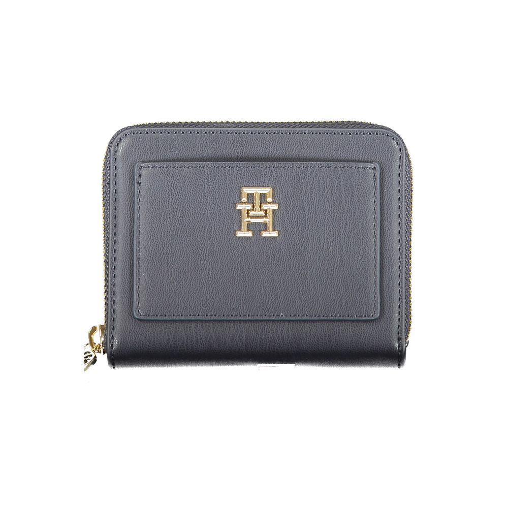 Tommy Hilfiger blue wallet with zip closure, two compartments, card slots, coin purse, external pocket, and logo emblem.