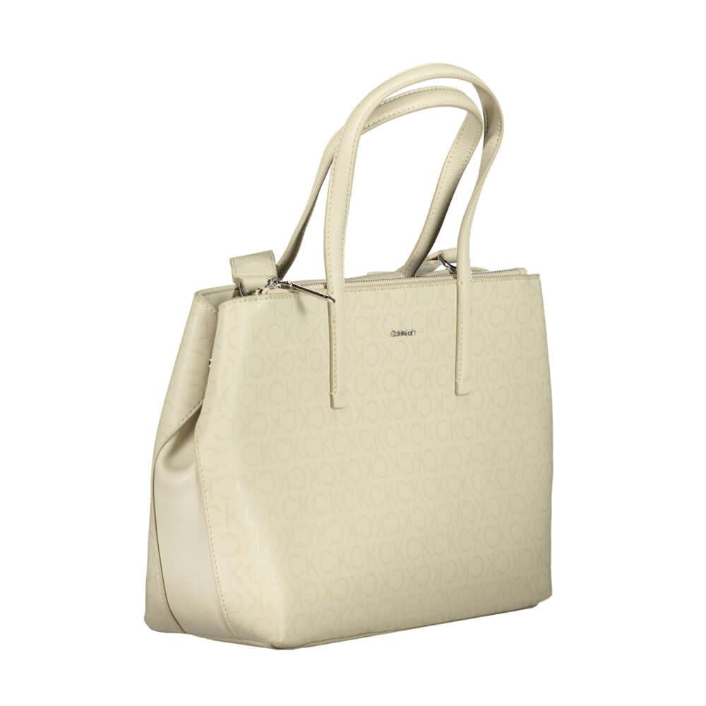Calvin Klein Beige Polyester Handbag with adjustable strap, external pocket, and logo design.