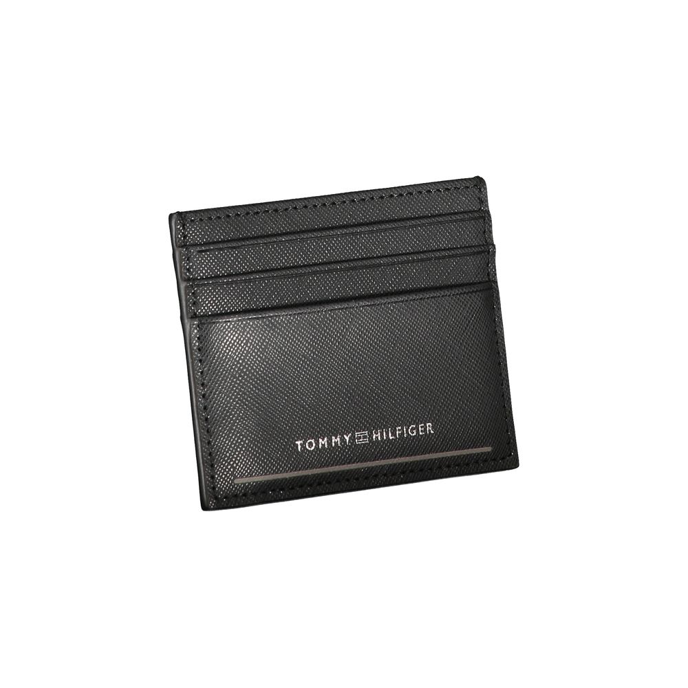 Tommy Hilfiger Black Leather Wallet with card holder, central pocket, and contrast details featuring logo.