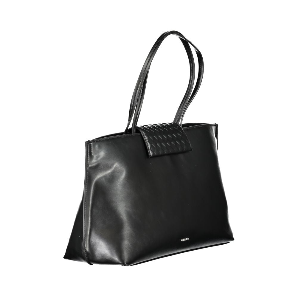 Calvin Klein Black Polyester Handbag with two shoulder handles, internal pocket, contrast details, and magnetic closure.