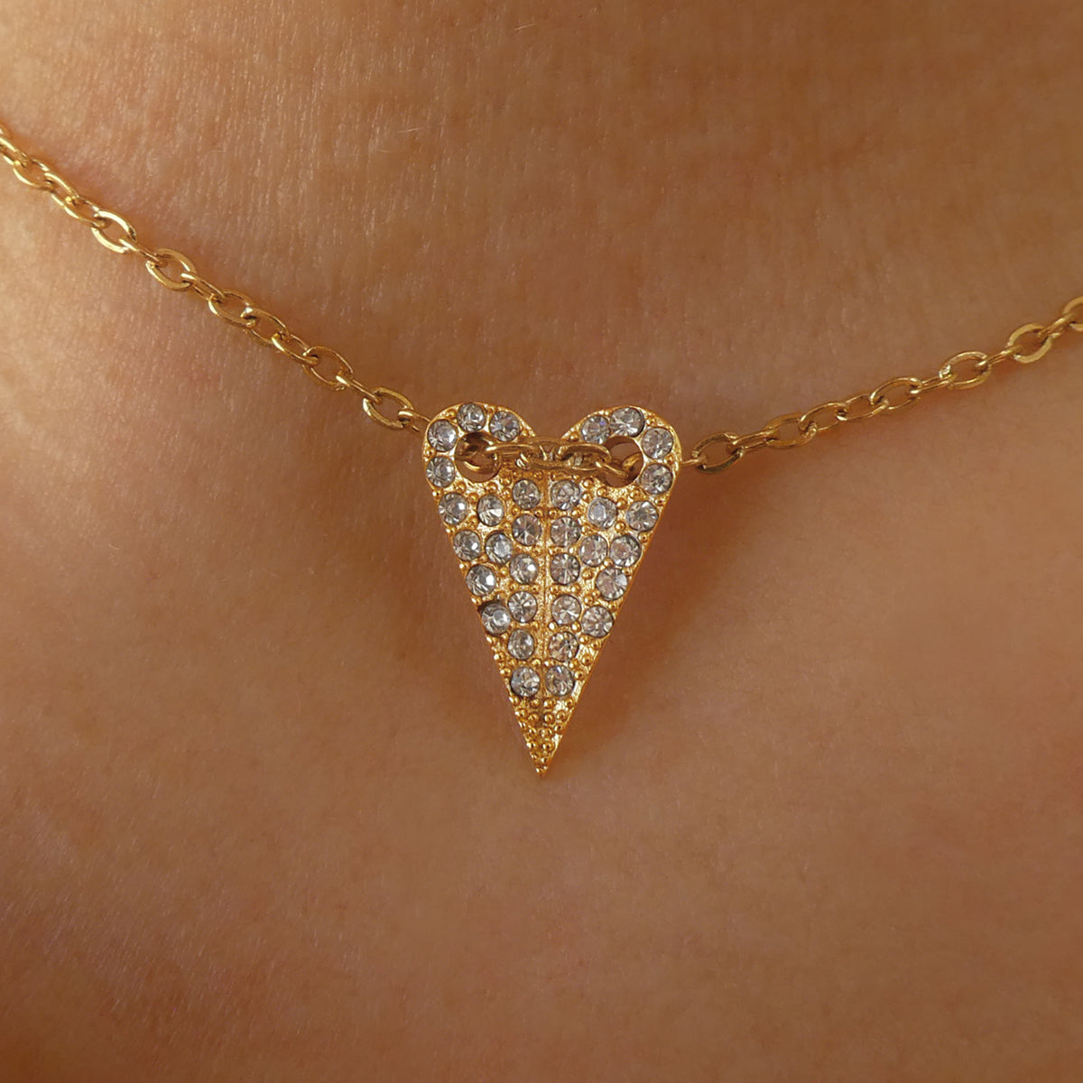 Gold necklace with diamond heart pendant, AN JEWELS JEWELRY Mod. AL.NMOH24CZ displayed elegantly on skin.