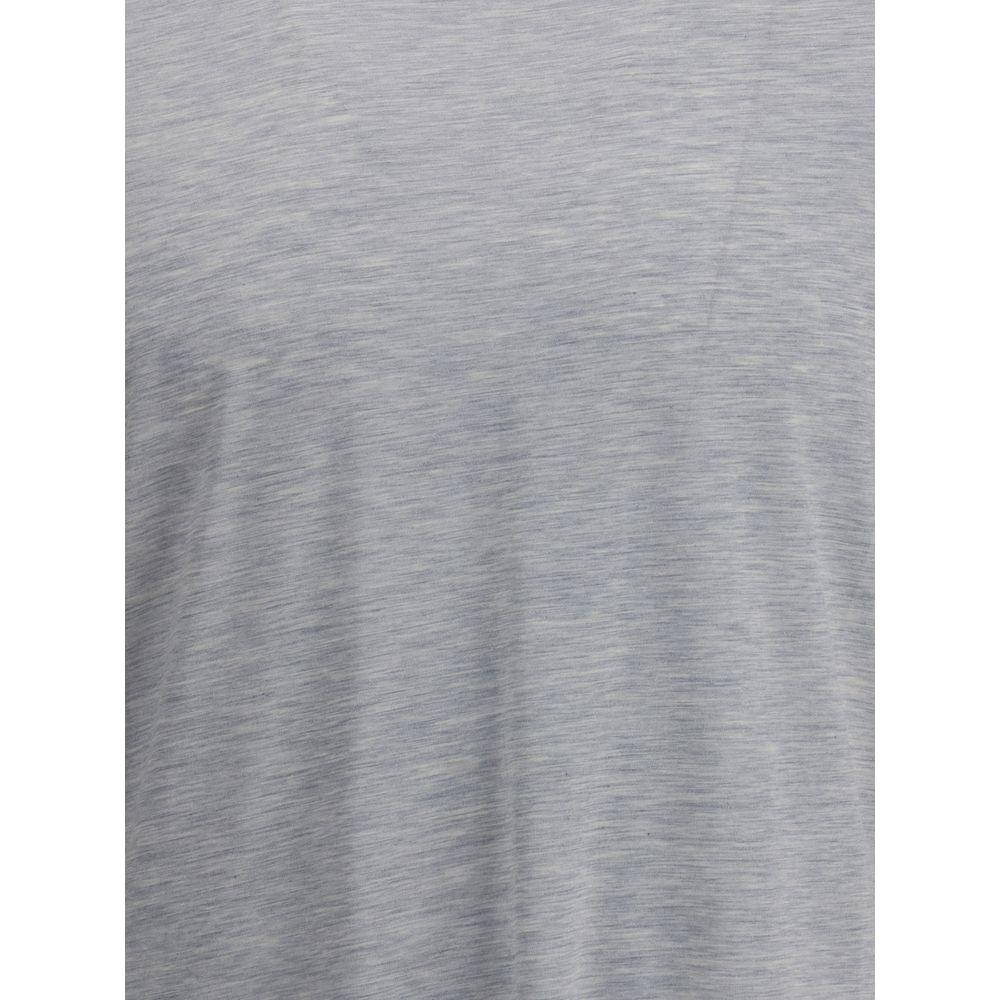 Brunello Cucinelli Silk T-ShirtBrunello Cucinelli’s signature silk T-Shirt expresses a refined, contemporary style. The essential crew neck and monochrome pattern enhance the lightness and natural sheen of the fabric, while the small side slits add moveme