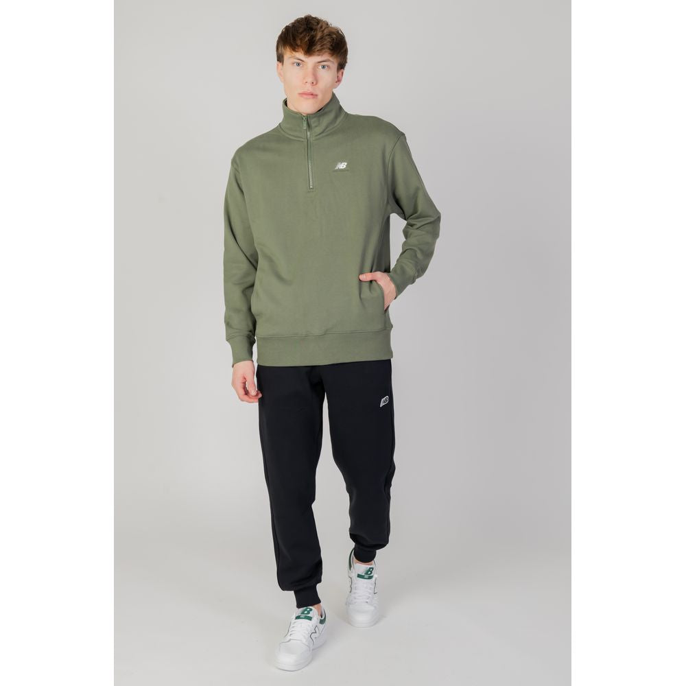 Model wearing New Balance Green Cotton Sweatshirt with half-zip high collar, showcasing casual and modern style.