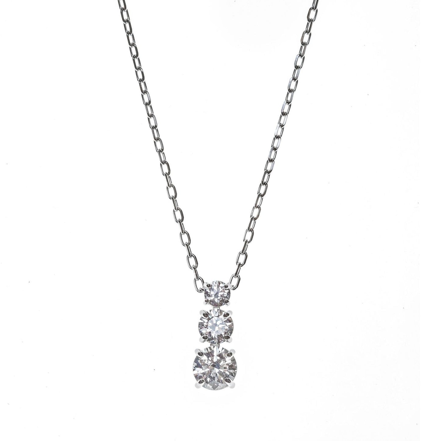SWAROVSKI Mod. 5414970 Attract Trilogy Pendant Necklace with round cut stones, symbolizing eternal love, rhodium plated design.
