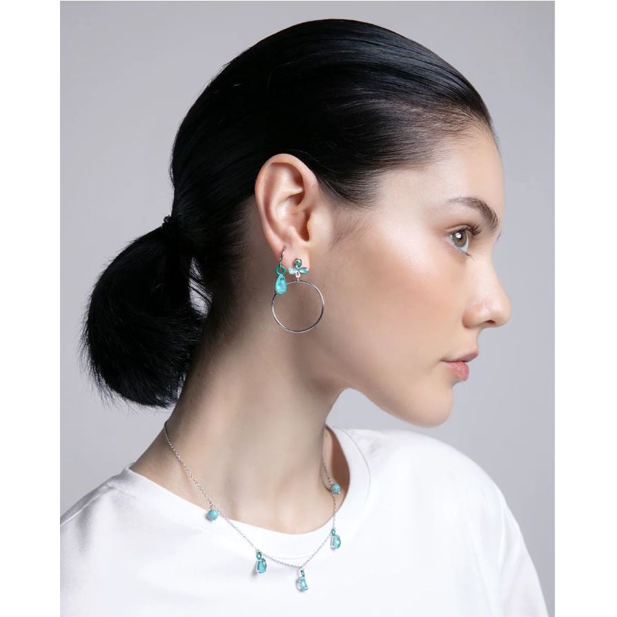 Lady wearing silver earrings and necklace showcasing VICEROY JEWELS Mod. 13198E000-33 in a side profile