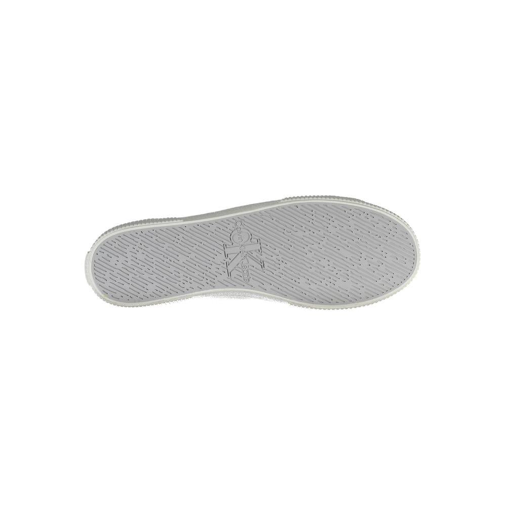 Sole of Calvin Klein white polyester men's sneaker with logo detailing and textured grip, highlighting sustainable design.