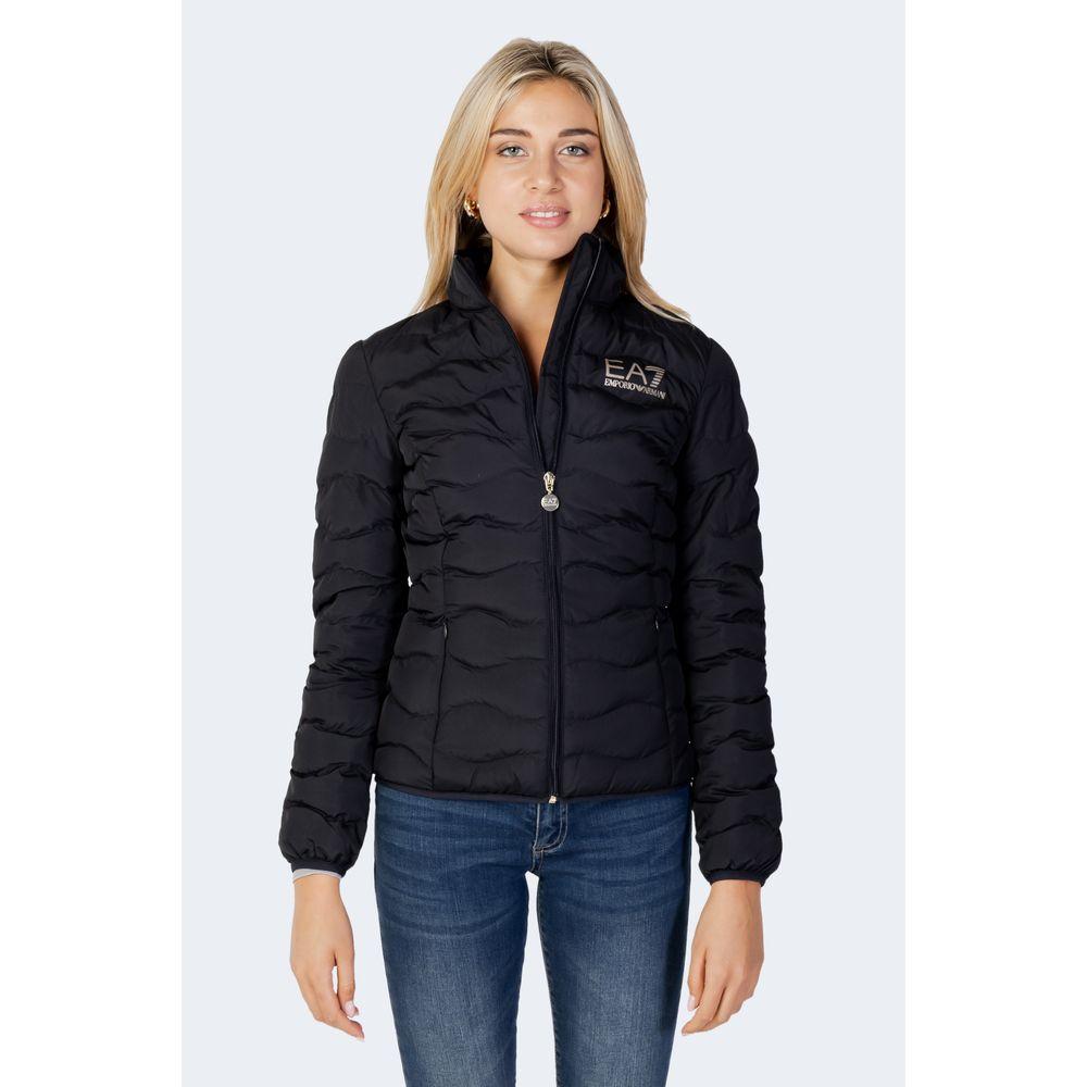 Woman wearing EA7 Emporio Armani black polyester down jacket, featuring lightweight warmth and comfort, perfect for winter.