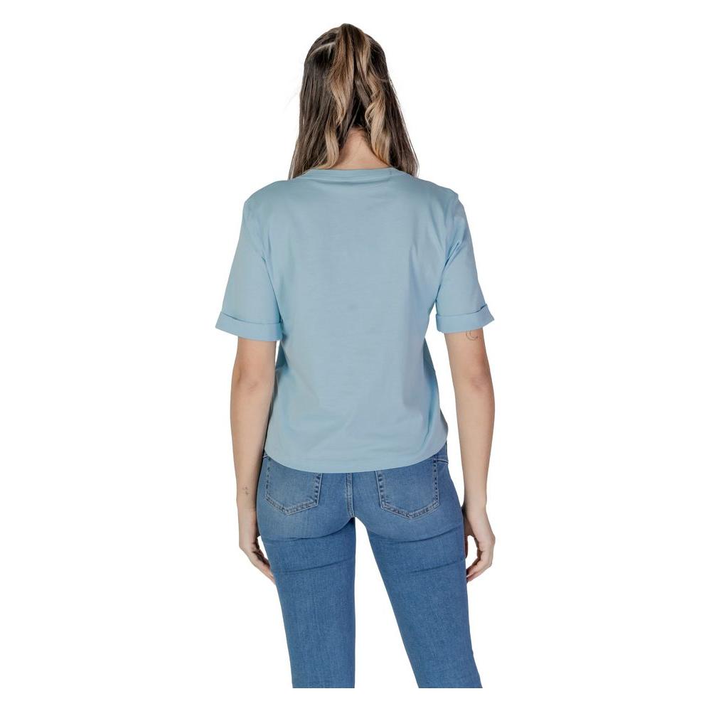 Back view of woman wearing Liu Jo blue cotton short-sleeved t-shirt from Spring/Summer collection