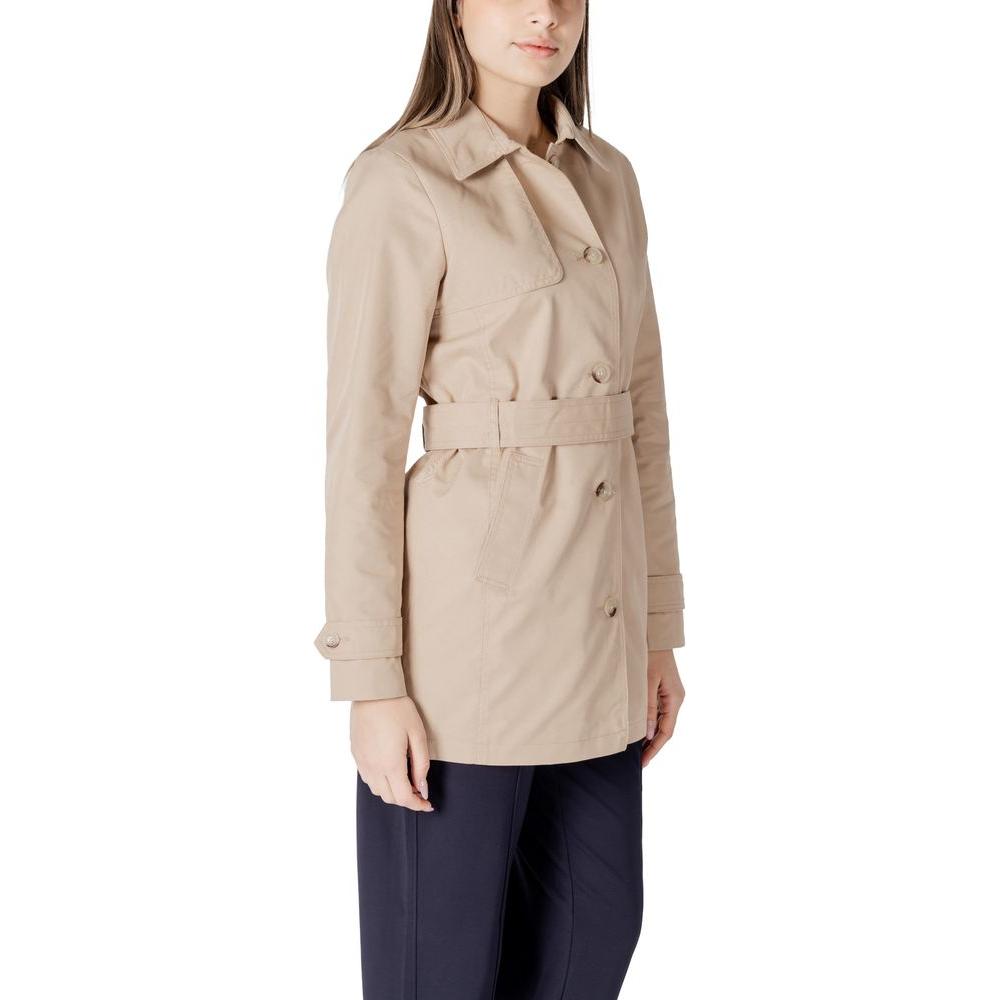 Woman wearing Street One beige cotton trench coat, showcasing elegant mid-length design, ideal for transitional seasons and everyday wear.