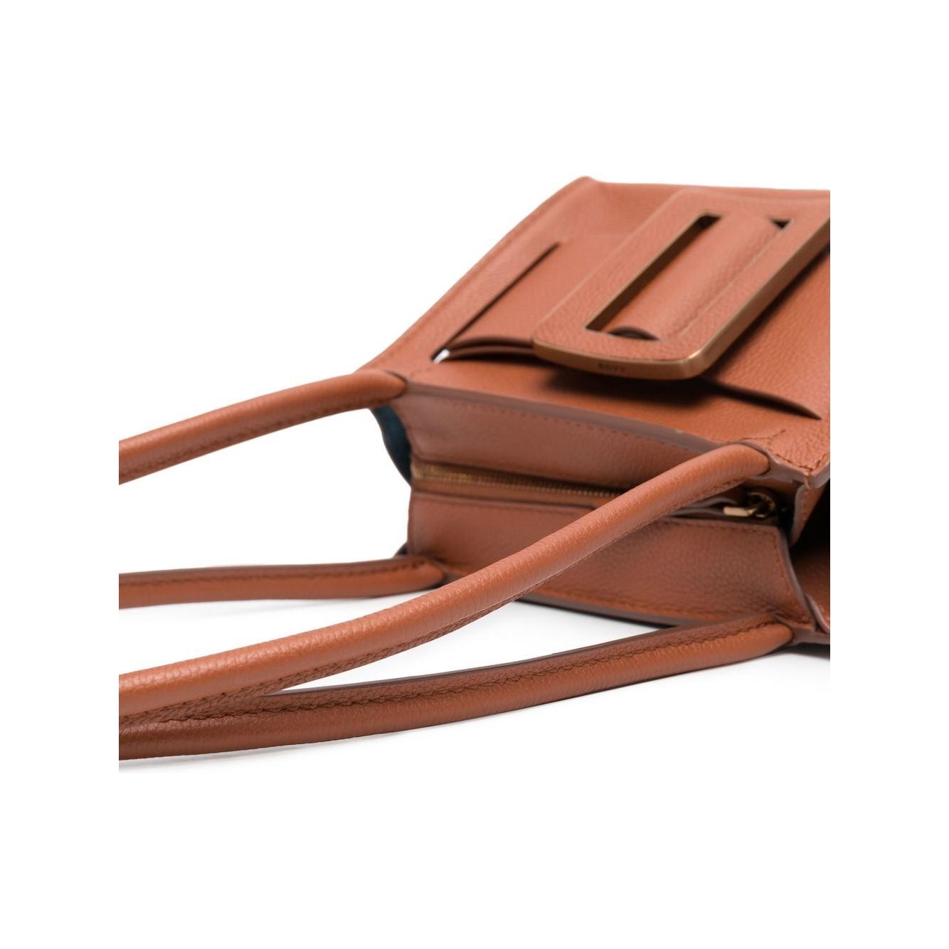 Front view with bag zipped and handles upright.