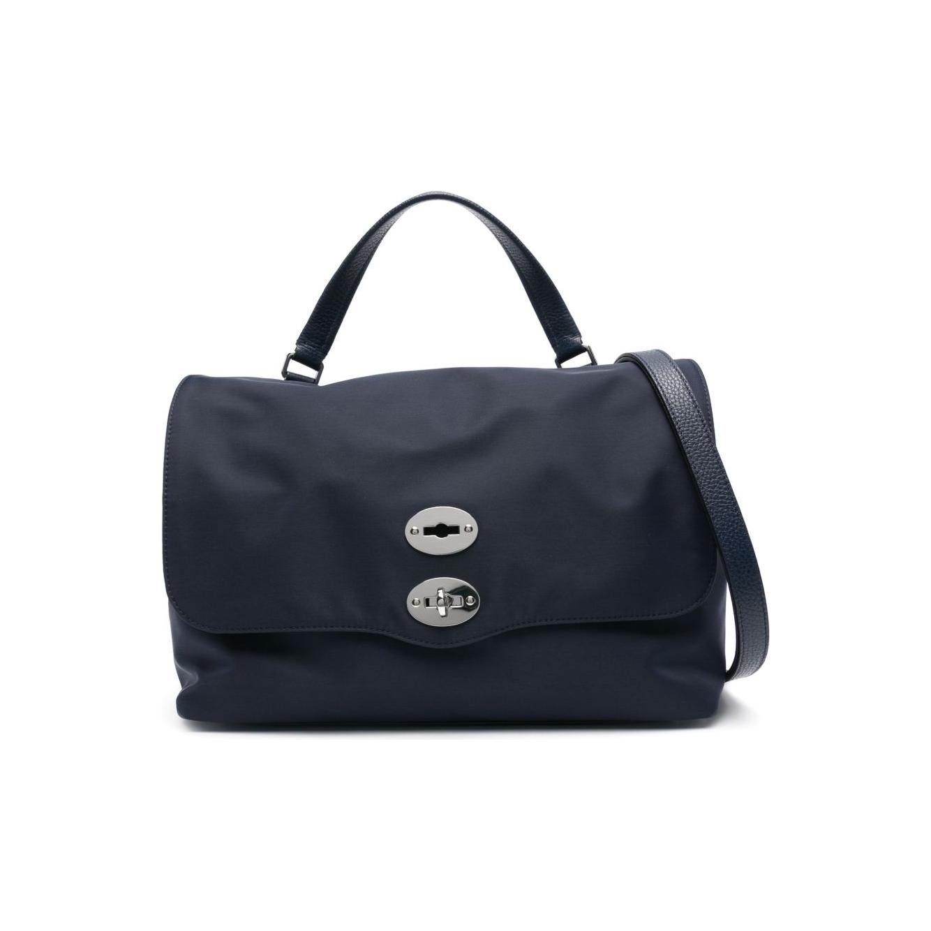 Front view with bag zipped and handles upright.