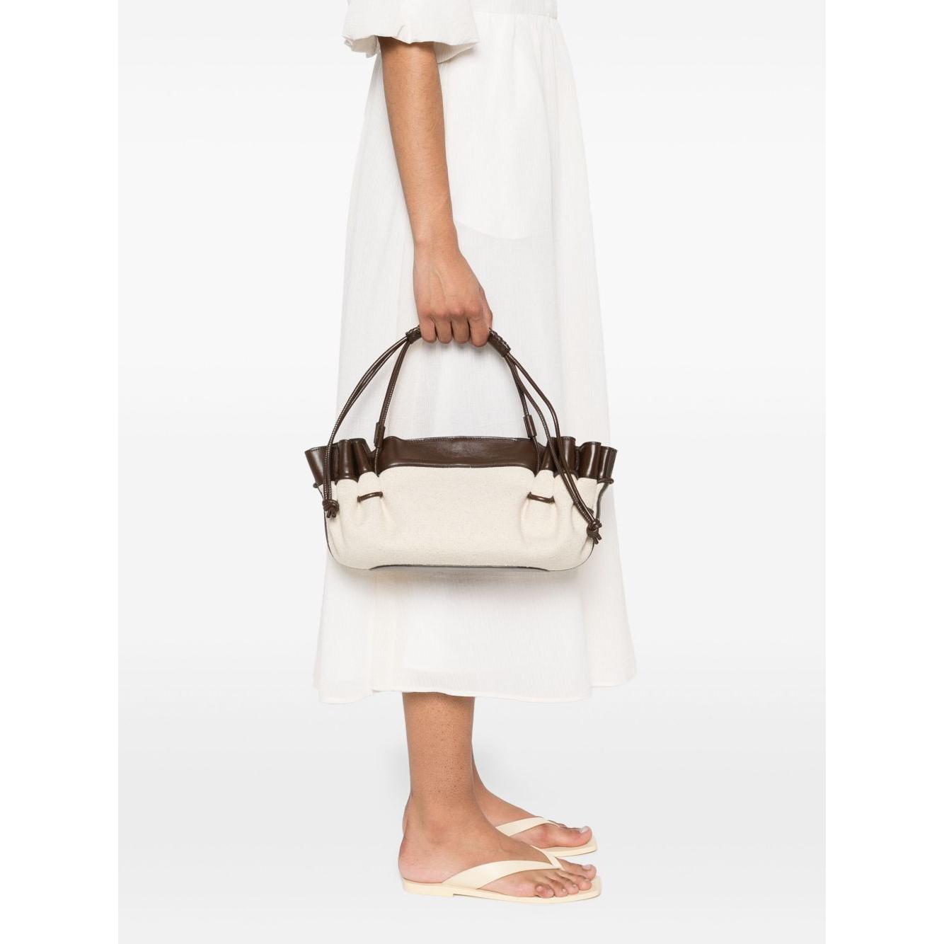 Front view with bag zipped and handles upright.