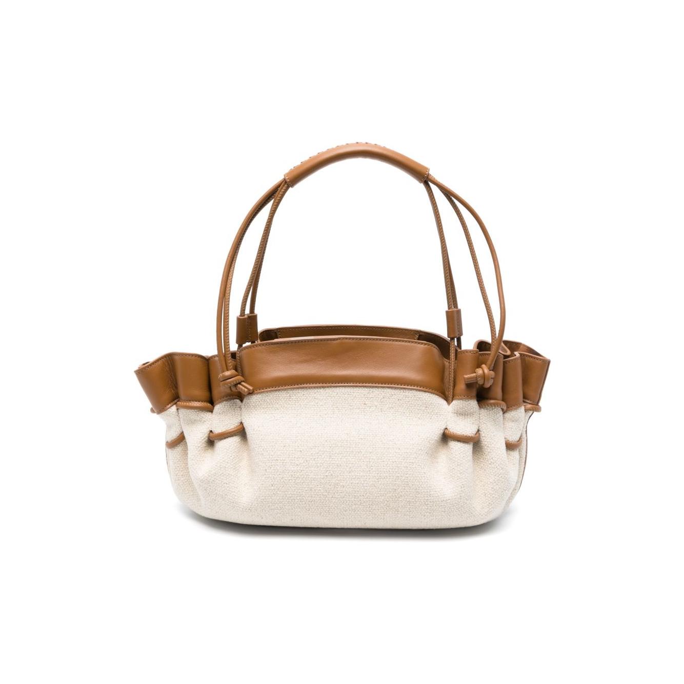 Front view with bag zipped and handles upright.