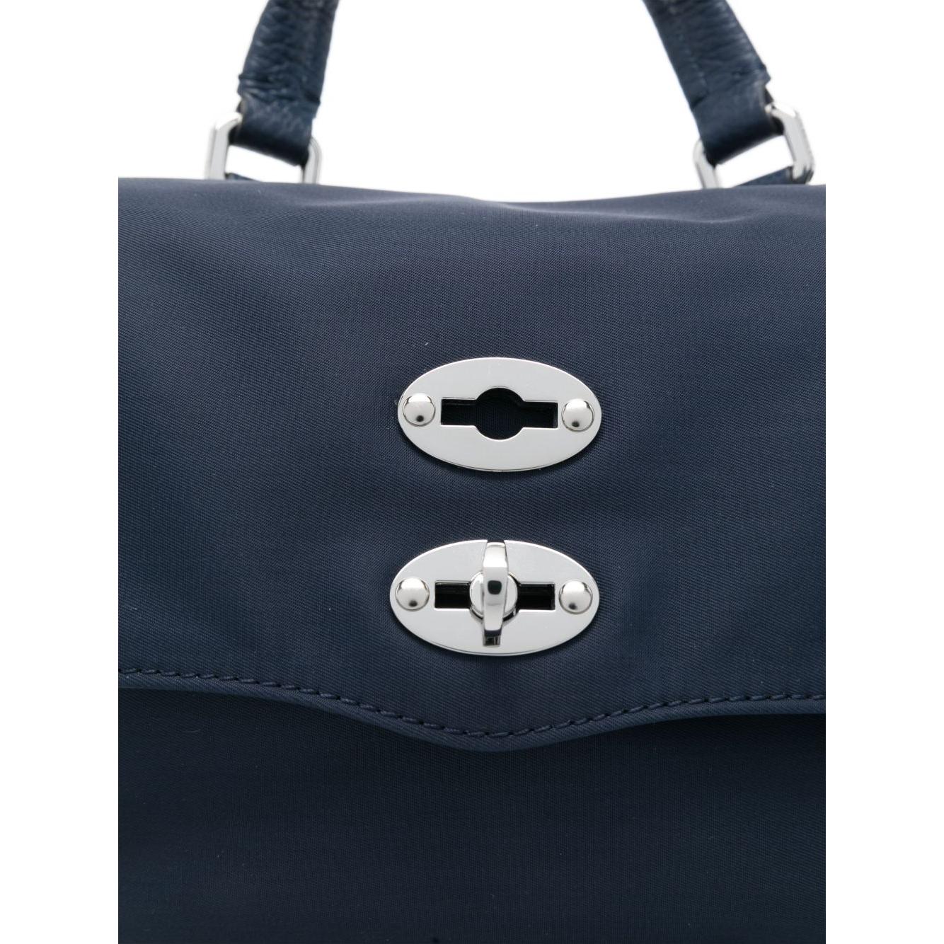 Front view with bag zipped and handles upright.