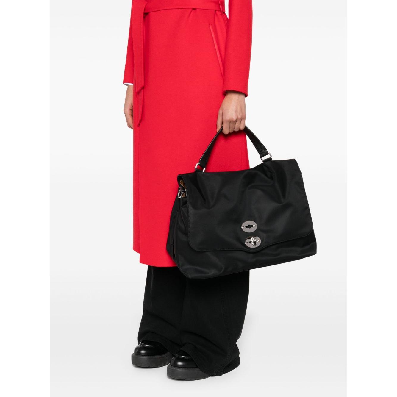 Front view with bag zipped and handles upright.