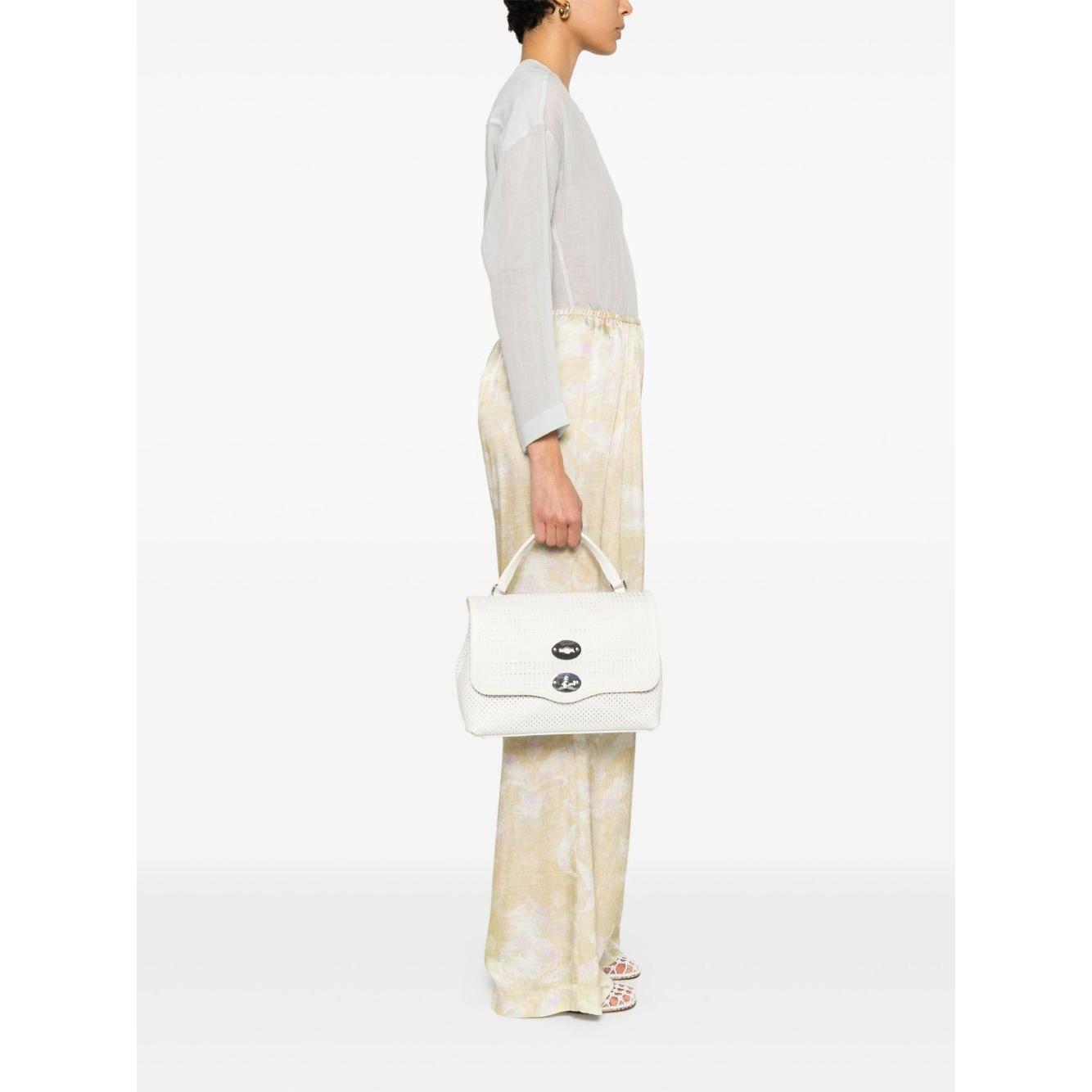 Front view with bag zipped and handles upright.