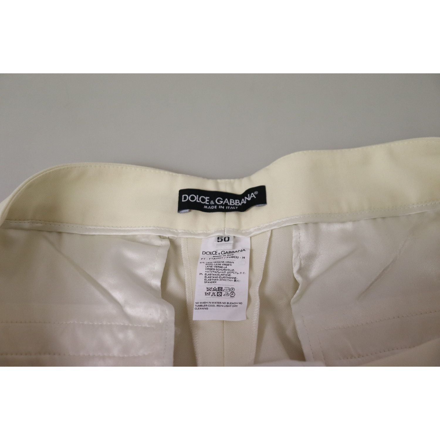 بنطلون صوف أنيق باللون العاجي بخصر مرتفع من دولتشي آند غابانا