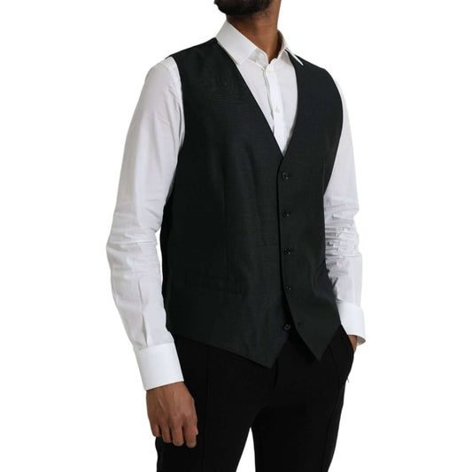 Dolce & Gabbana black wool waistcoat dress formal vest with adjustable strap, worn over white shirt. Luxury fashion made in Italy.
