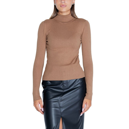 Woman wearing Jacqueline De Yong Brown Viscose Sweatshirt with a roll neck and long sleeves, paired with a black skirt.
