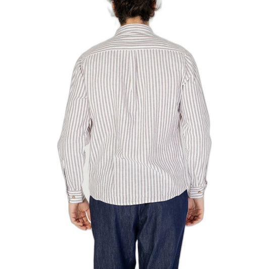 Back view of man wearing a Hamaki-Ho brown linen long-sleeve shirt from the spring/summer collection, paired with blue jeans.