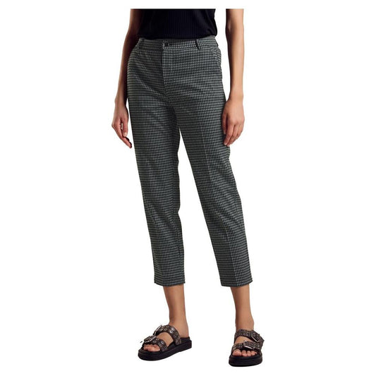 Woman wearing Street One green polyester pants, fall/winter collection.