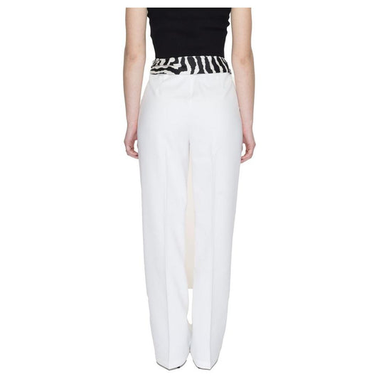 Back view of women's bootcut white polyester pants with black waistband from the Spring/Summer collection, featuring 11% elastane.
