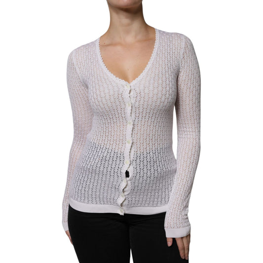 Dolce & Gabbana white silk button-down cardigan sweater with V-neck design and long sleeves. Lightweight, luxurious knit. Made in Italy.