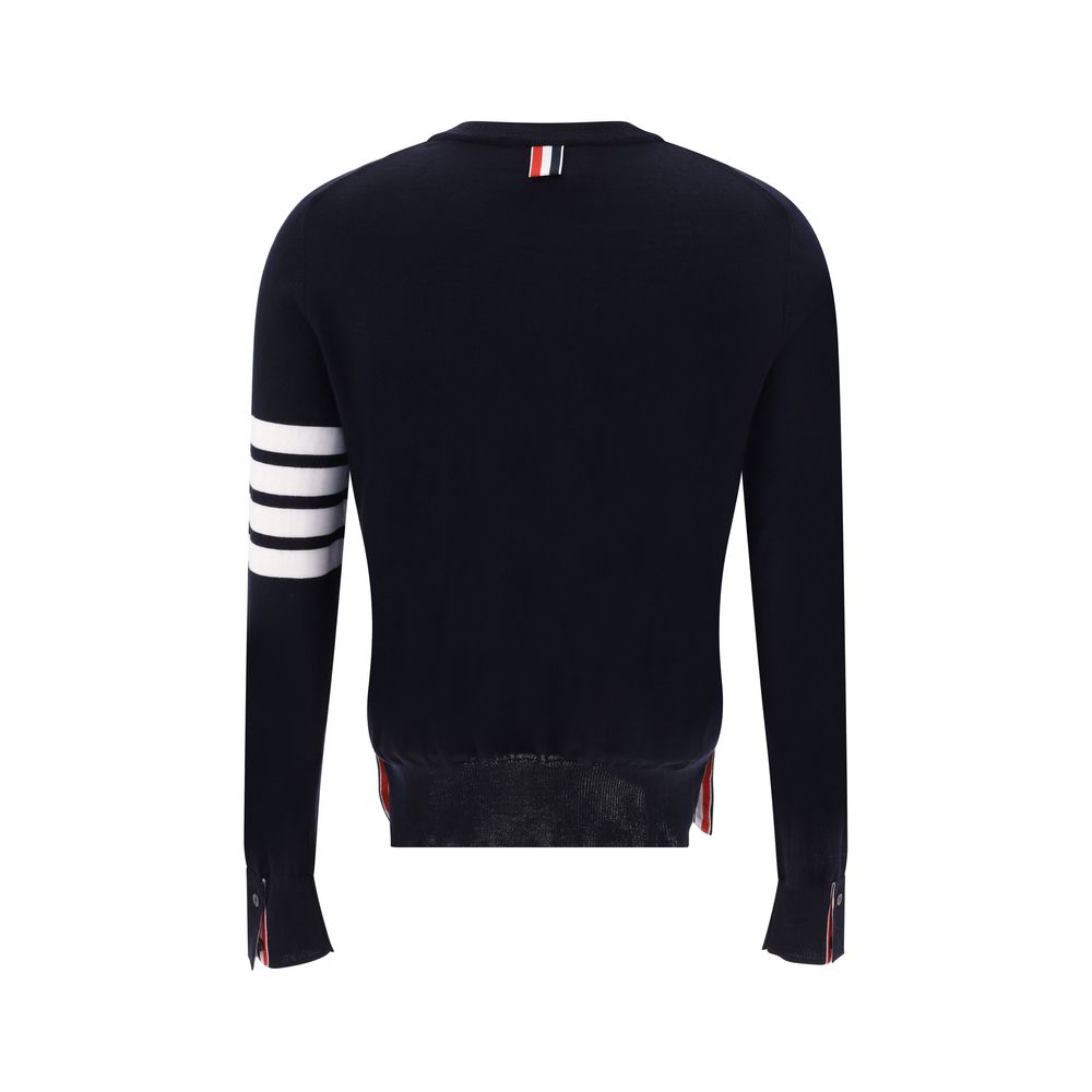 Alt Tag: Back view of Thom Browne Gray Fleece Wool Sweatshirt with signature stripes on left arm, ribbed cuffs with buttons.