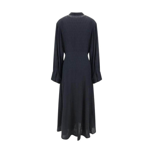 Back view of Valentino Toile Iconographe Chemisier Dress in silk with wide sleeves and ruffle midi skirt, featuring a smocked waistband.