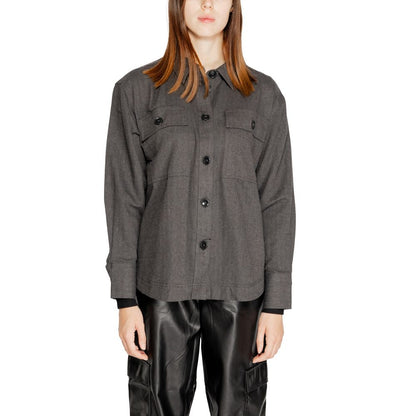 Jacqueline De Yong Black Recycled Cotton Blouse with long sleeves, button-up front, and relaxed fit worn by a model.