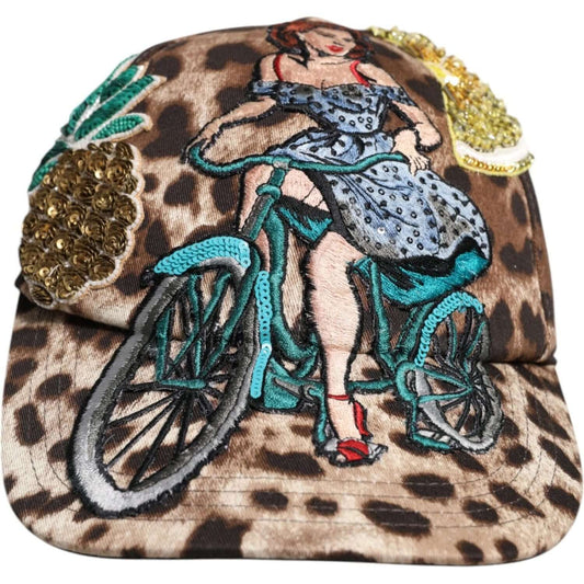 Dolce & Gabbana brown leopard print sequin baseball cap featuring embroidered woman on bicycle, silk lining, adjustable strap.