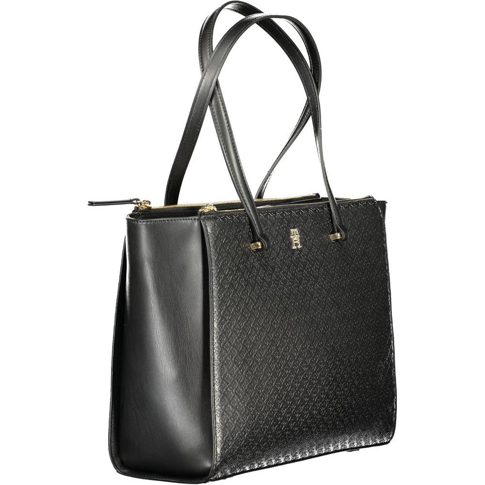 Front view with bag zipped and handles upright.