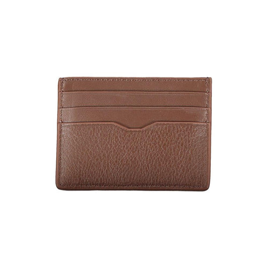 Tommy Hilfiger sleek brown leather card holder with contrast detailing and embossed logo, featuring central pocket for secure card storage.