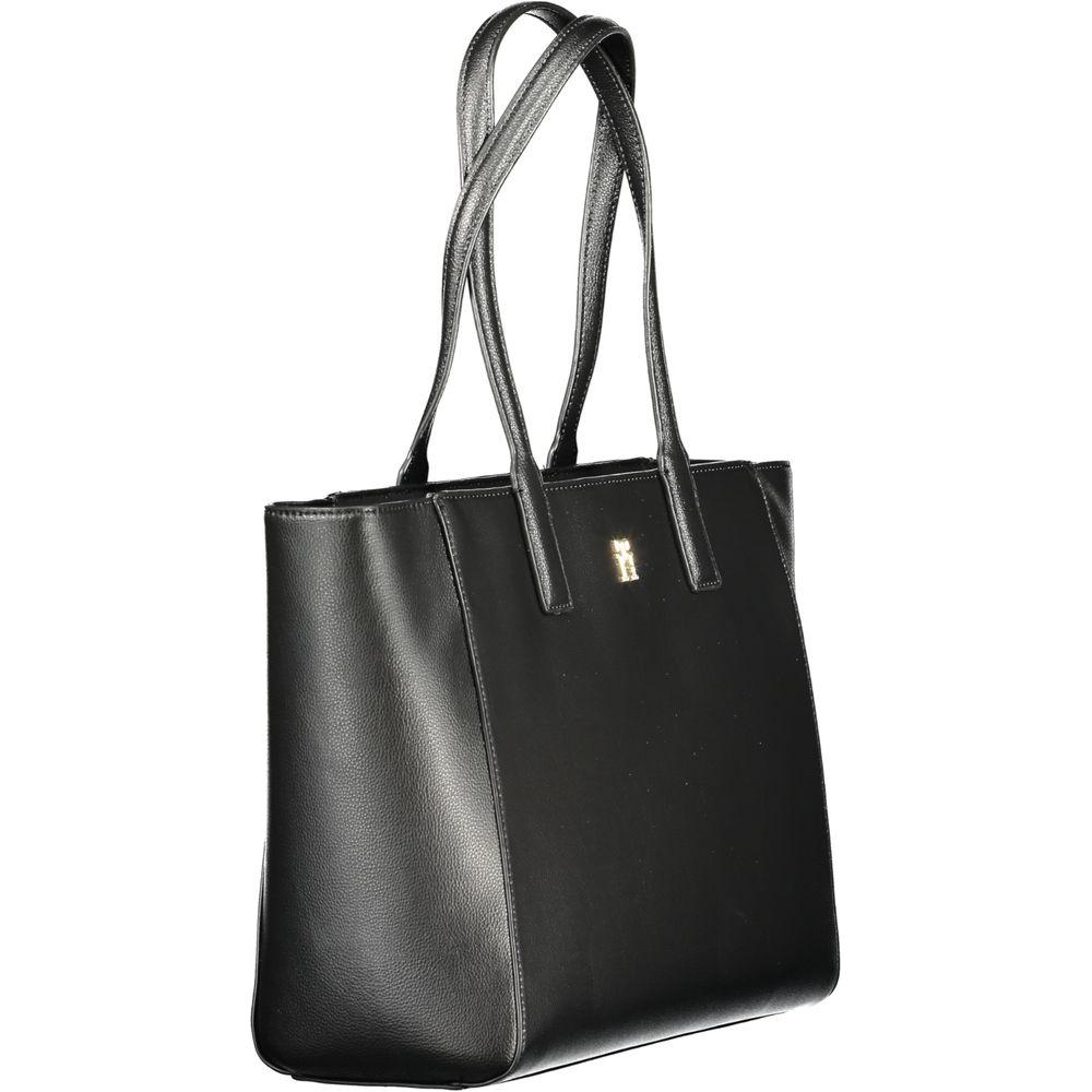 Front view with bag zipped and handles upright.