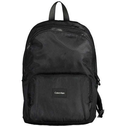 Calvin Klein Black Polyester Men Backpack with bold logo and multiple pockets, eco-friendly 100% recycled material, adjustable straps.