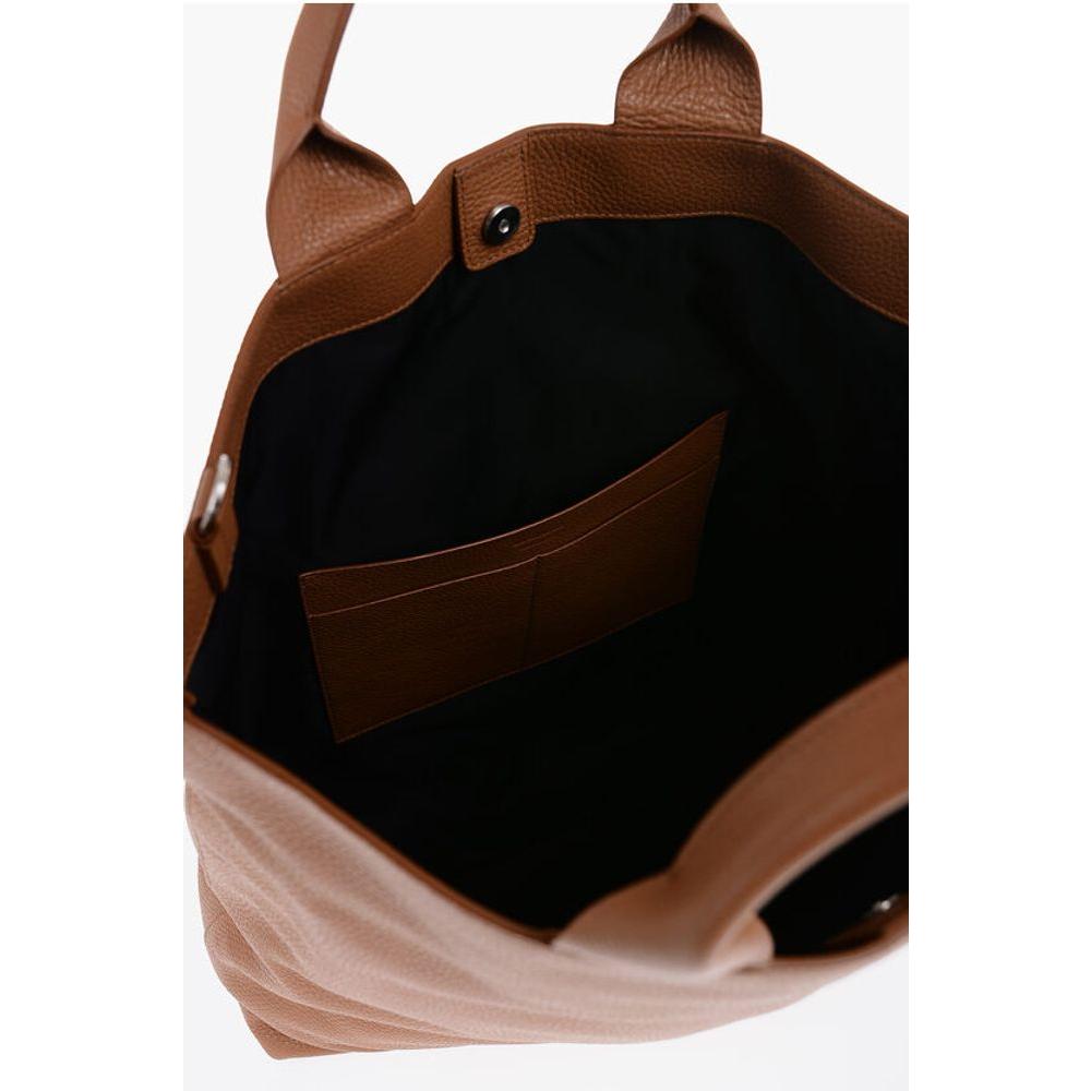 Front view with bag zipped and handles upright.