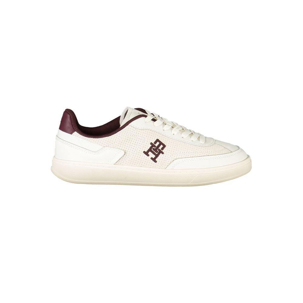 Tommy Hilfiger Beige Leather Women Sneaker with brown accents and logo embroidery, showcasing chic style and comfort for fashion enthusiasts.