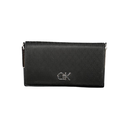 Calvin Klein Black Polyester Women Handbag with elegant silver logo and chic design, perfect for style and functionality.