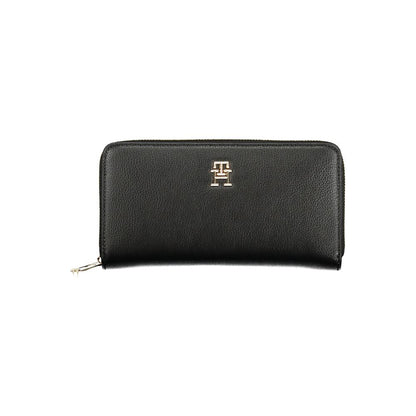 Tommy Hilfiger Black Polyethylene Women Wallet with logo and zip closure, offering organization with multiple compartments for cards and cash.