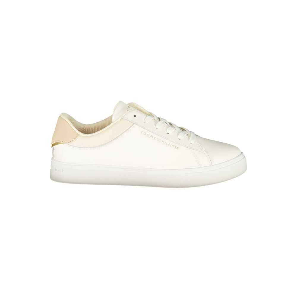 Tommy Hilfiger Beige Leather Women Sneaker with iconic logo on sleek beige trainers showcasing style and comfort.