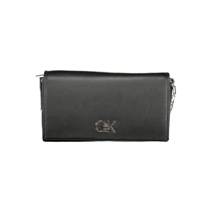 Calvin Klein Black Polyester Handbag with adjustable strap, two compartments, and twist closure detailing.