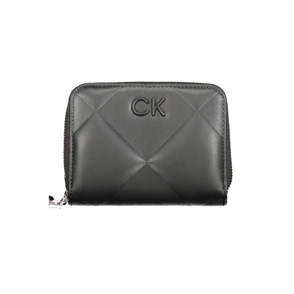 Calvin Klein Black Polyester Wallet with zip closure, logo, and contrasting details. RFID blocking feature, space for cards and coins.