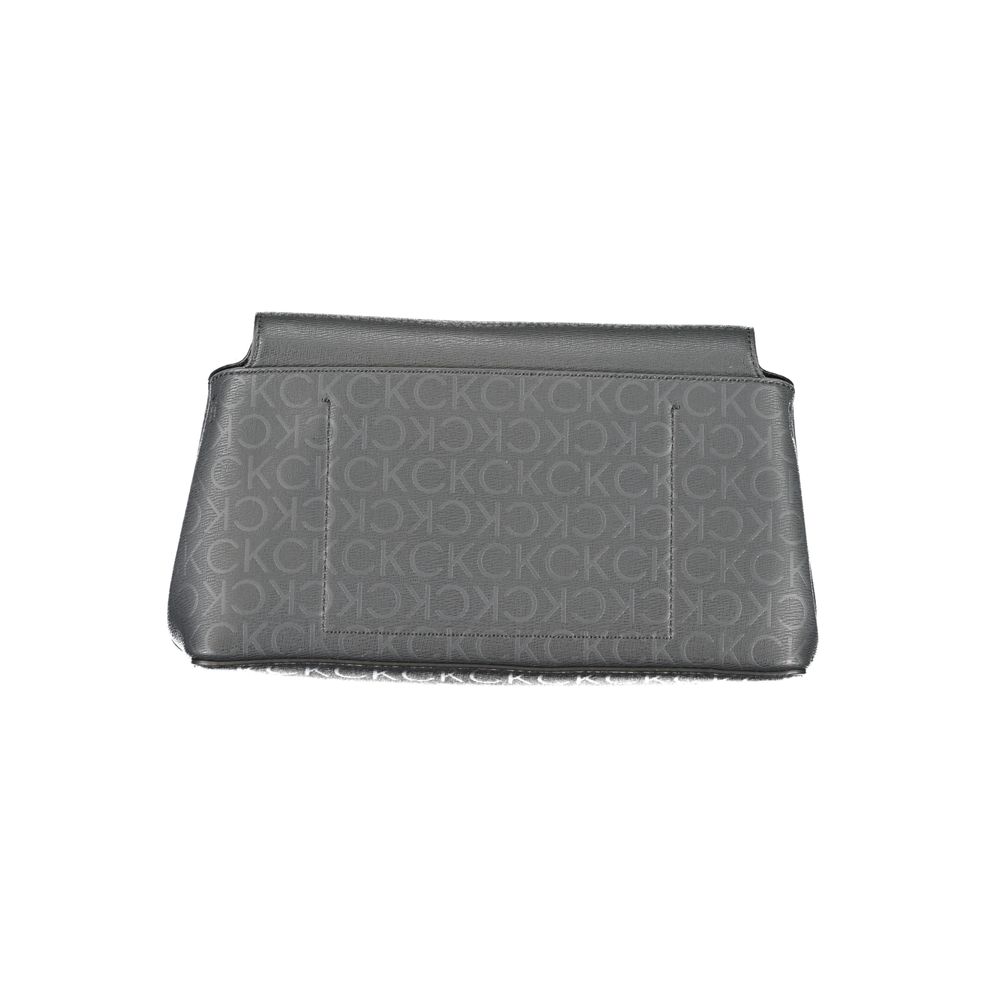 Calvin Klein Black Polyester Handbag with adjustable strap, internal pocket, snap closure, and logo details.