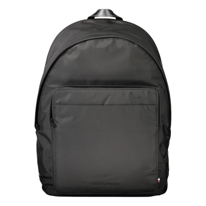 Tommy Hilfiger Black Polyester Backpack with logo, adjustable straps, external pockets, and laptop compartment.