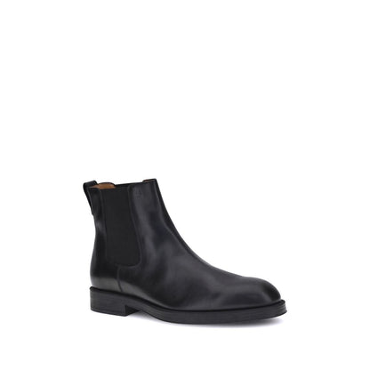 Alt Tag: Tod's Black Calf Leather Bos Taurus Chelsea Boots with elastic side inserts and back tab for ease of fit.